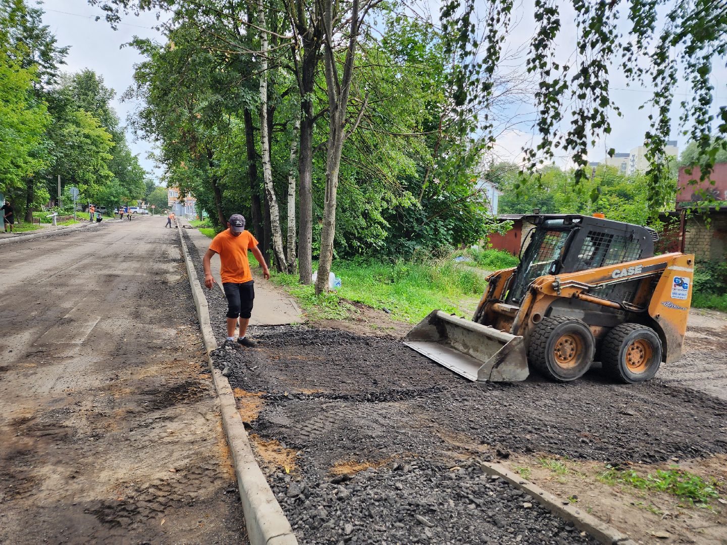 чехов, улица ильича, дорожный ремонт, замена покрытия, установка бордюров, ремонт тротуаров и съездов, капремонт дороги, госпрограмма московской области, развитие дорожного комплекса, парковочные карманы,